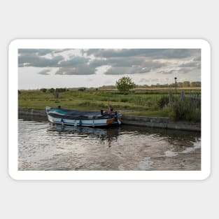 Small wooden pleasure boat moored in Thurne Dyke Sticker